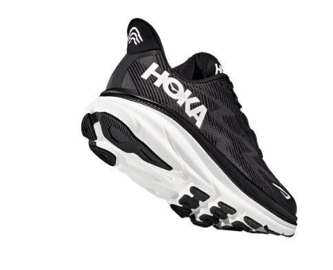 Back angled view of the Men's HOKA Clifton 9 in the color Black/White