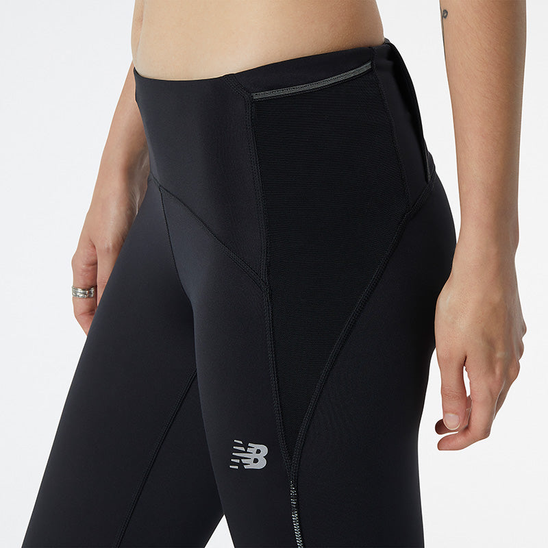 NB DRYx premium, fast-drying technology wicks moisture away from your body to help you dominate your workout Mid rise sits just below the waist for easy fit and movement Poly knit material for a comfortable feel Cropped length Fitted silhouette designed to feel snug at the hip and thigh and allow for a range of motion without excess fabric Back zippered pocket and drop-in hip pockets for nutrition and valuables Storage tunnel to store extra layers for a hands-free workout